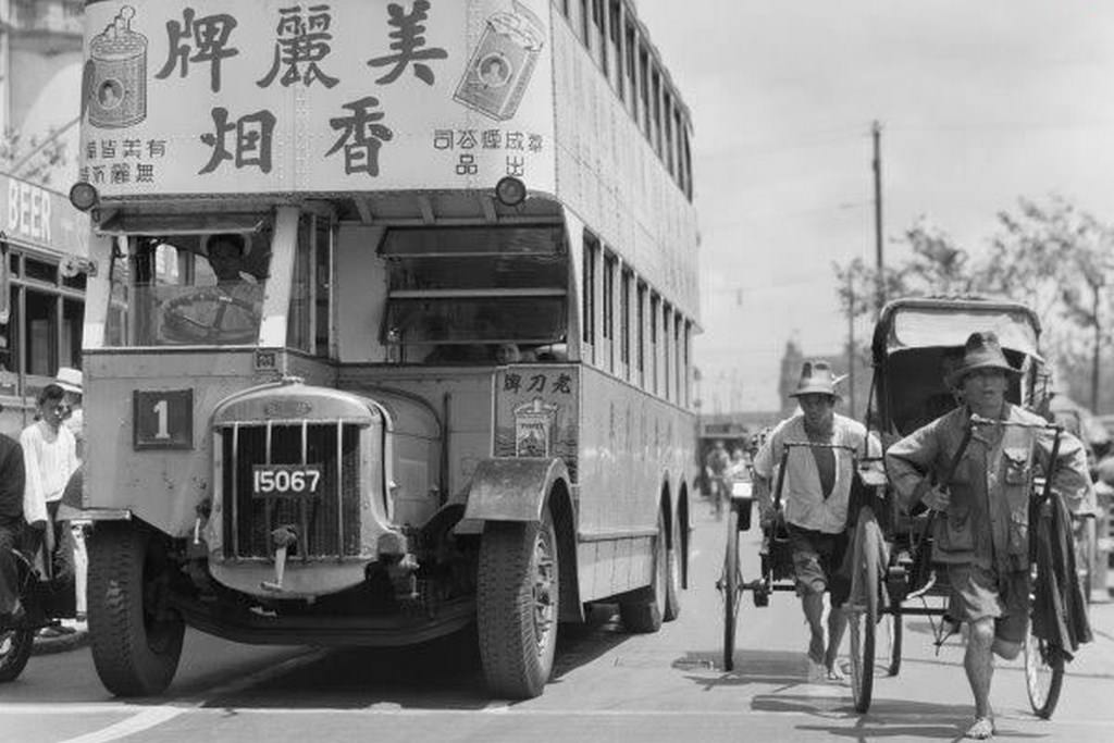#98 Shanghai Bund in 1935, where public buses were “invaded and taken over” by all types of advertisements.