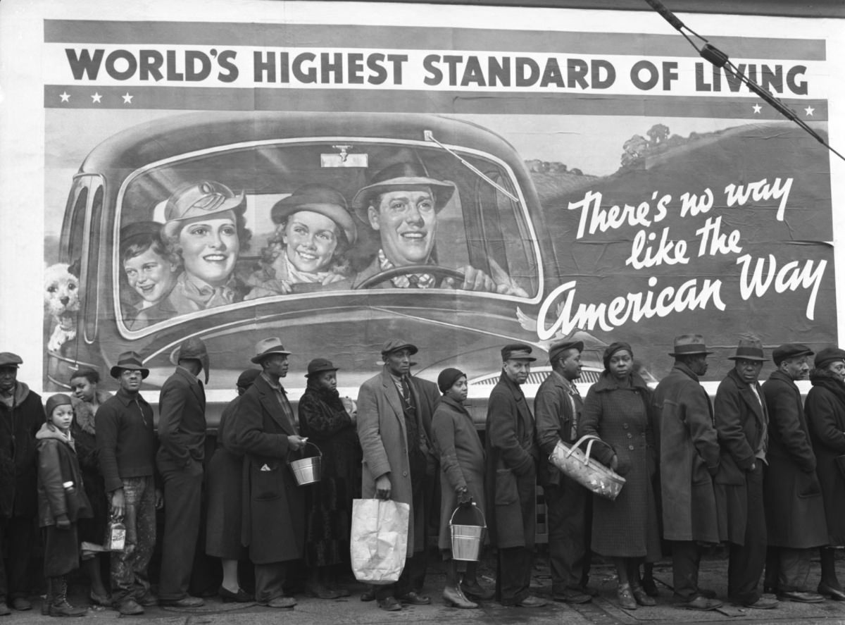 #7 During the Great Ohio River Flood of 1937, men and women in Louisville, Kentucky, line up seeking food and clothing from a relief station.