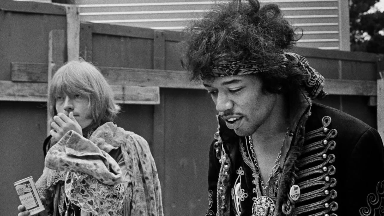 #26 Brian Jones and Jimi Hendrix backstage at the Monterey Pop Festival, 1967.