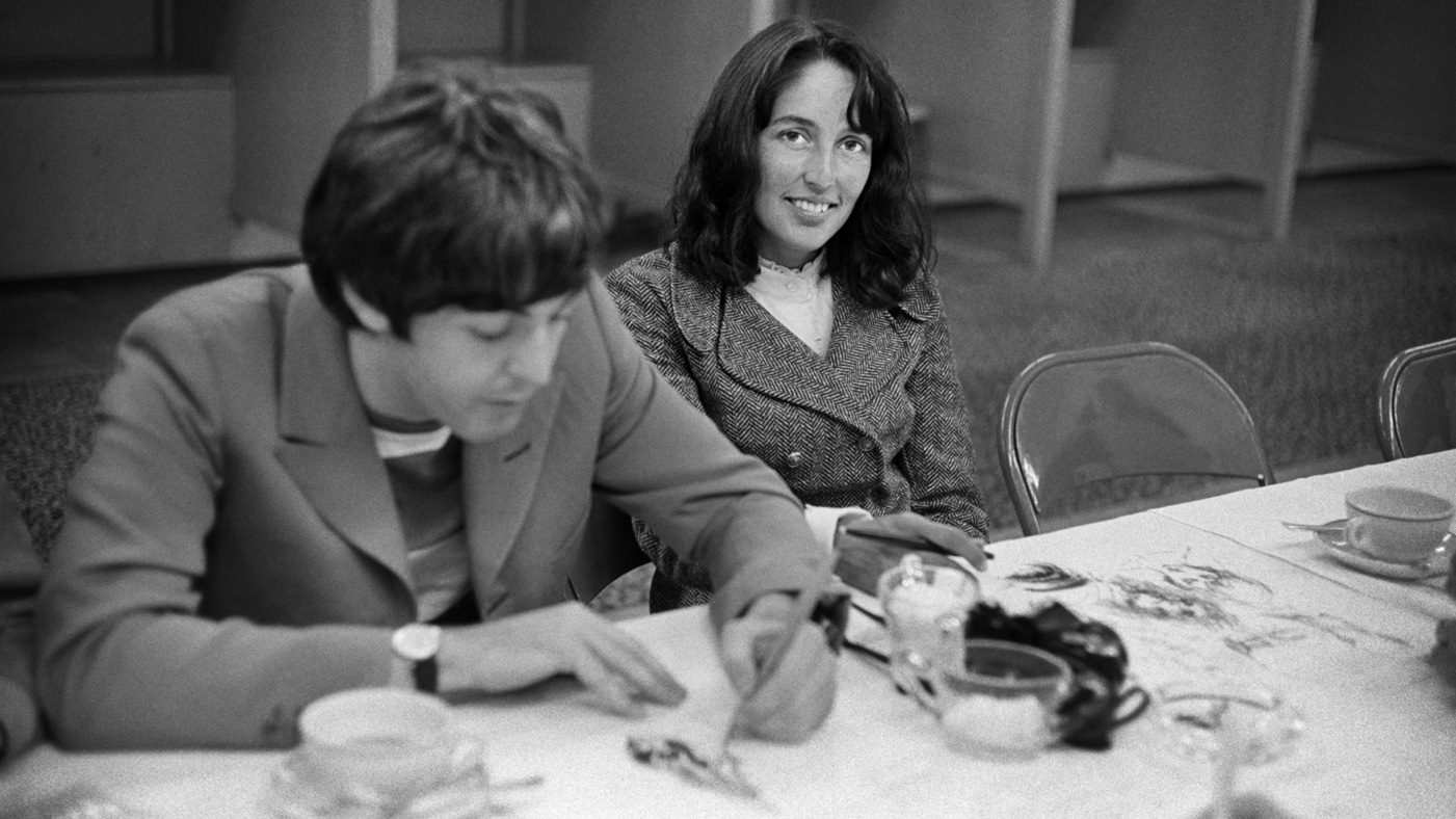 #4 Joan Baez and Paul McCartney doodling backstage at Candlestick Park in 1966.