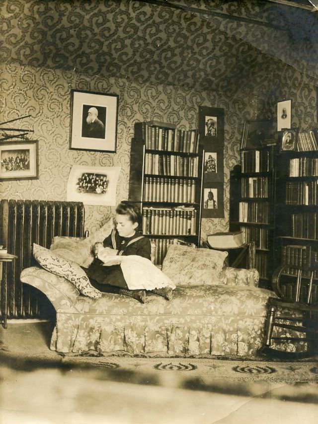 #12 Girl on sofa holding doll