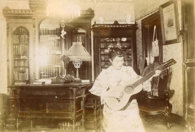 #29 Young woman playing a guitar