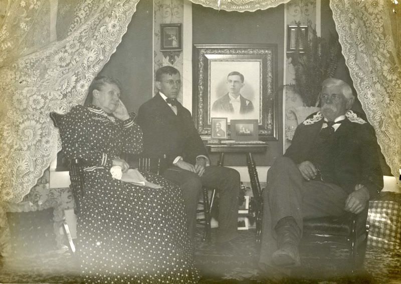 #8 Family seated in front of lace curtain