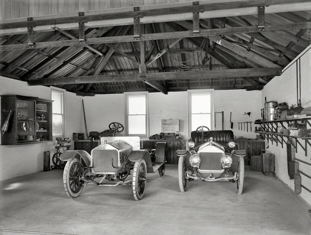 #71 Wolseley and Cadillac motor cars in garage, Christchurch, New Zealand, circa 1908