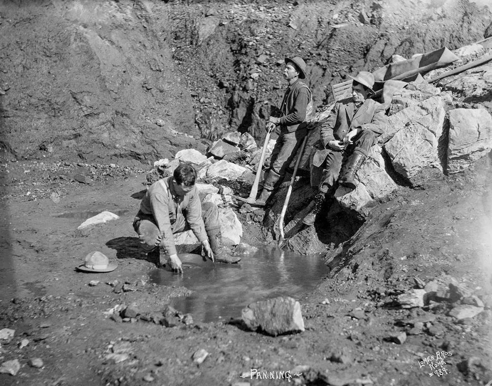 #13 Men panning for gold (during the Alaskan Gold Rush).