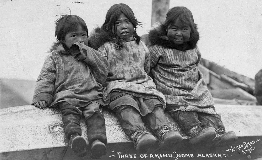 #8 Three Eskimo children.