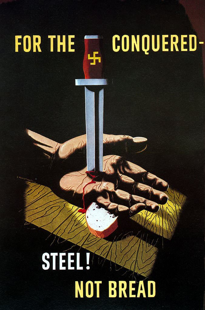 #159 Poster from World War II depicts a hand pinned to a table by a German dagger, with the words ‘For the conquered – steel! not bread’, 1942.