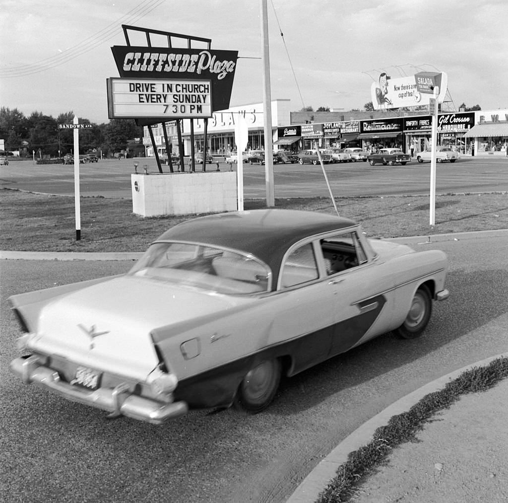 A car entering a Candian shopping mall’s car park for a drive-in church service in Scarborough, 1955