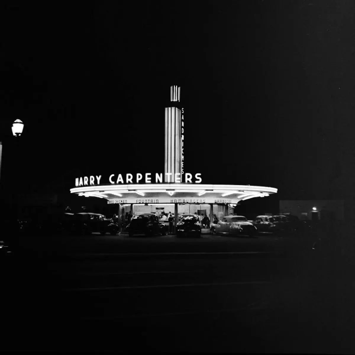 #45 A neon sign at a drive-in restaurant in Hollywood, California, 1942.