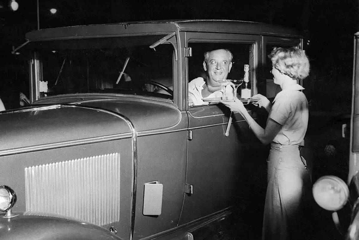 #57 After prohibition ended in 1933, people found just about any and every reason to toast. Some drive-ins served alcohol. 1940s.