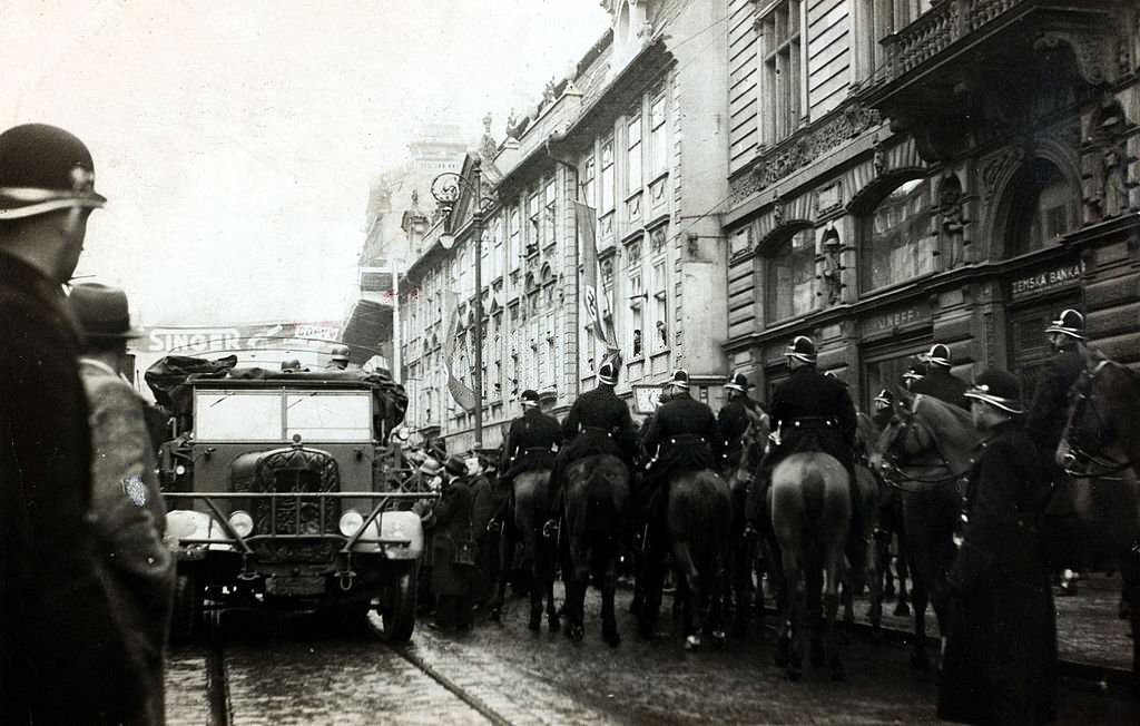 #104 The Occupation of Czechoslovakia, Czech mounted police watching a German truck pass through the streets of Prague
