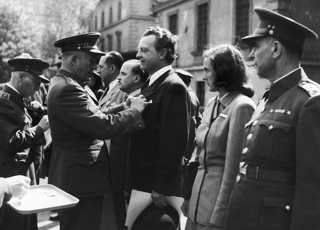 #12 Czech General Ludvik Svoboda decorates members of the Revolutionary Factory Committees, who took over the running of facilities after the Germans were defeated, 1945.