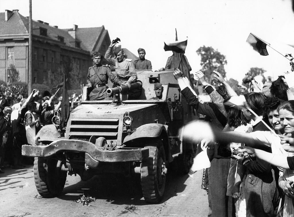#17 The liberation of Prague, May 1945. Soviet troops being greeted by citizens of Prague.