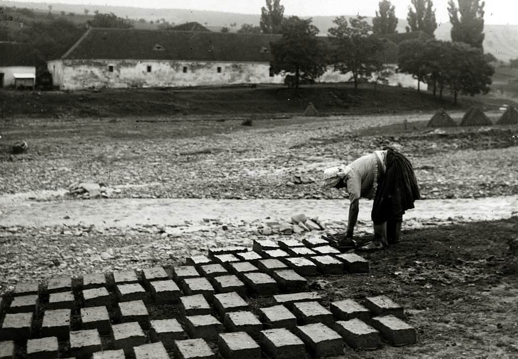 #57 A Czech woman pressed into service making bricks after the German occupation of her country, Adolf’s Hitler’s Germany invaded Czechoslovakia in March 1939
