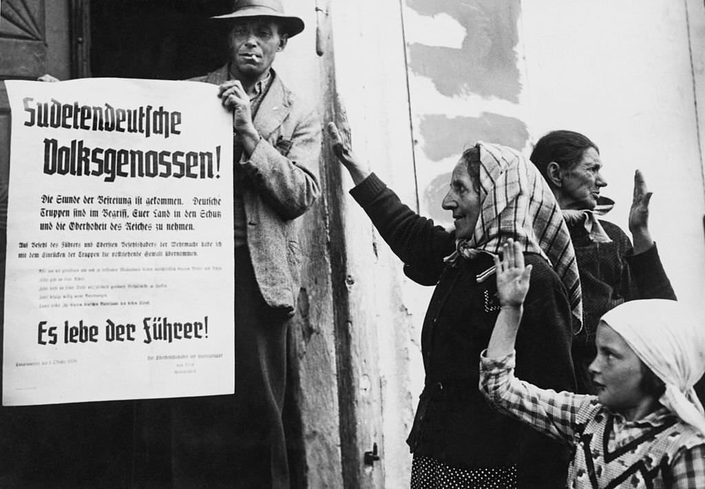 #77 Ethnic Germans salute a message of liberation from German commander Wilhelm Ritter von Leeb after the German annexation of the Sudetenland, 2nd October 1938.