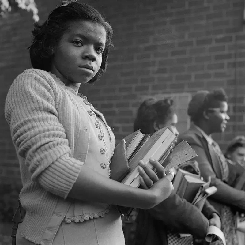 #26 A student waits for the bus in a small town in Tennessee.