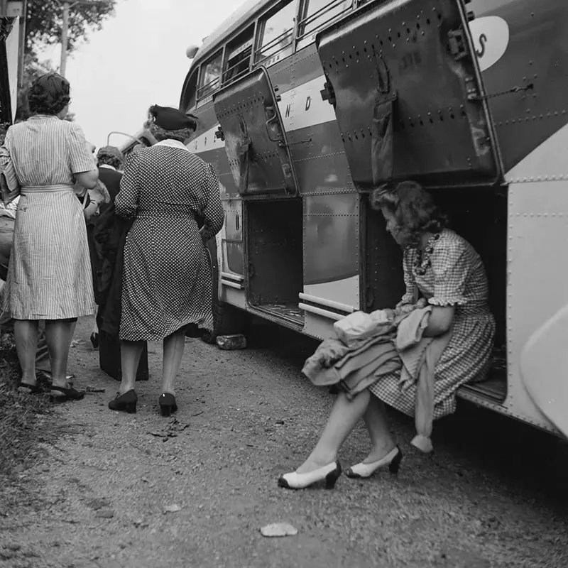 #40 A passenger watches luggage being unloaded from a bus that broke down in a small town in Pennsylvania.