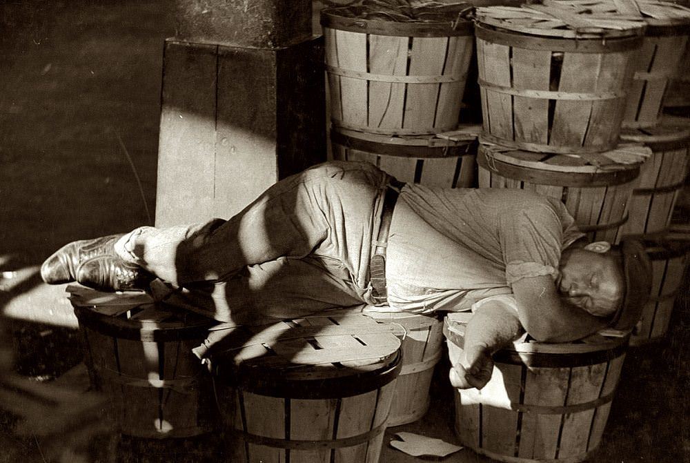 #2 Man sleeping in the Baltimore fish market, July 1938