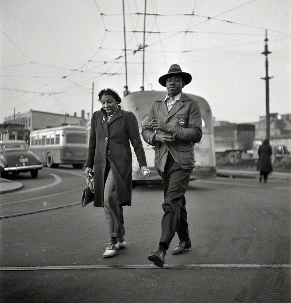 #47 Workers hurrying to catch a conveyance for their jobs at 7 a.m, Baltimore, Maryland, April 1943