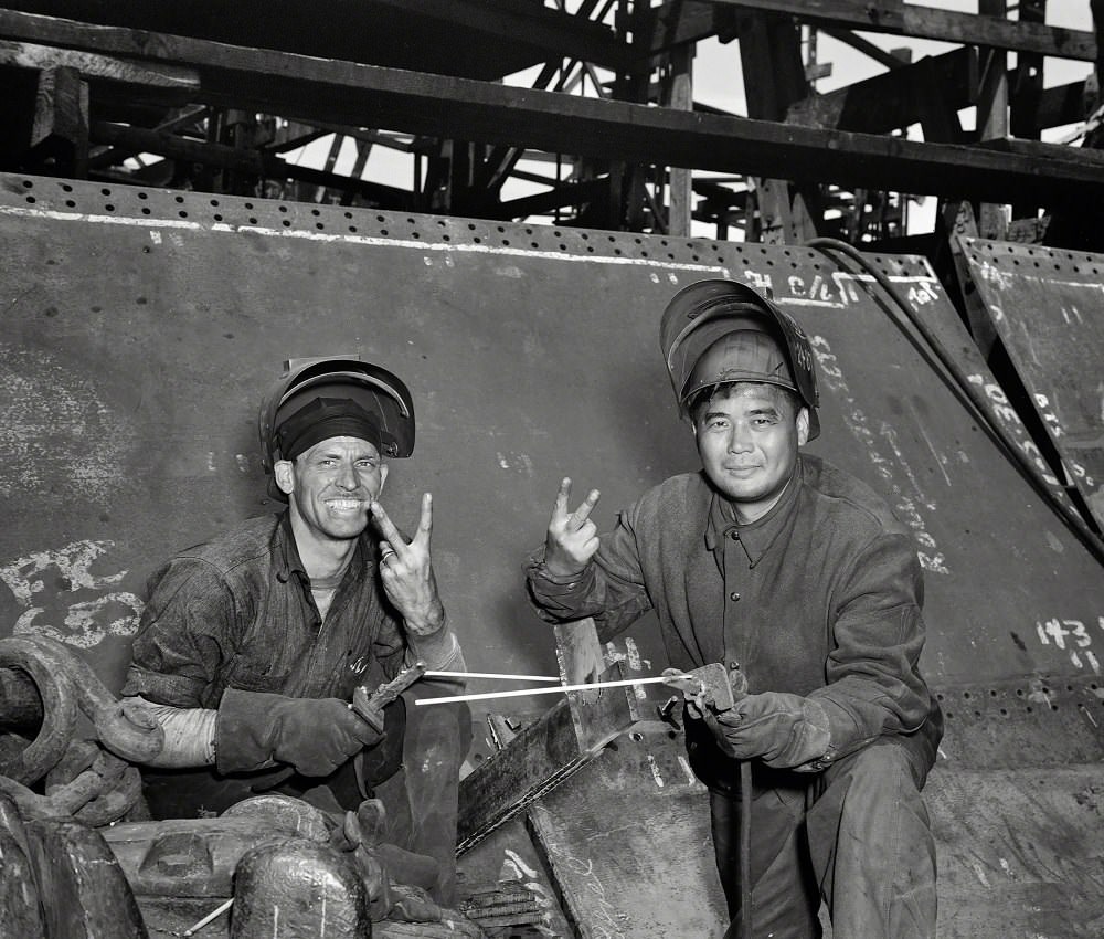 #52 Electric welders working on the Liberty ship Frederick Douglass at the Bethlehem-Fairfield shipyards, Baltimore, Maryland, May 1943