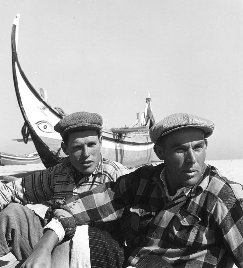 #27 Portuguese fishermen relax on the beach at Nazare, 1952
