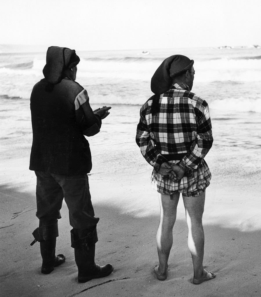 #18 Two fishermen from Nazare in Portugal prepare for the day’s fishing.