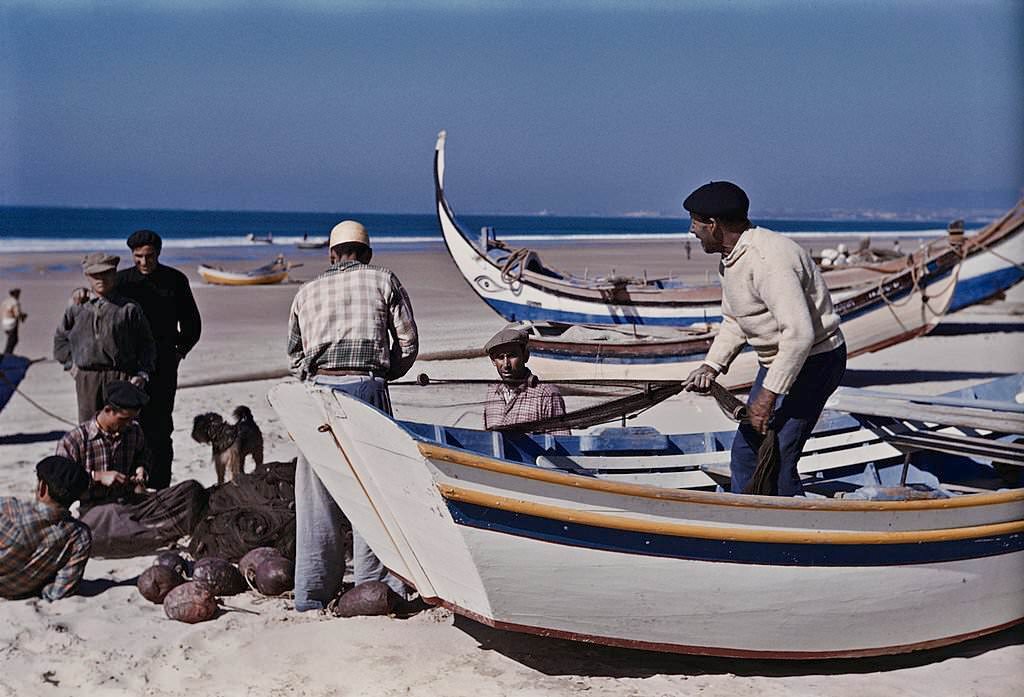 #7 Fishermen with their boats on the beach at Nazare, Portugal, 1952.
