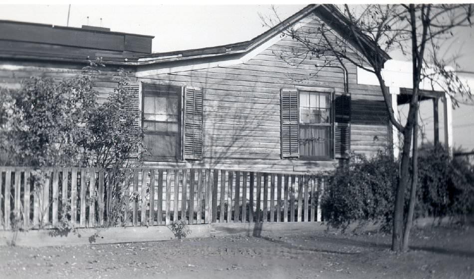 #117 Side view of wooden house, 1940