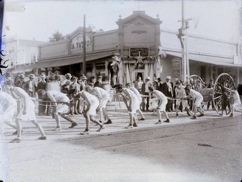 #15 Possibly a parade, young men pulling hose, Lodge building, 1860