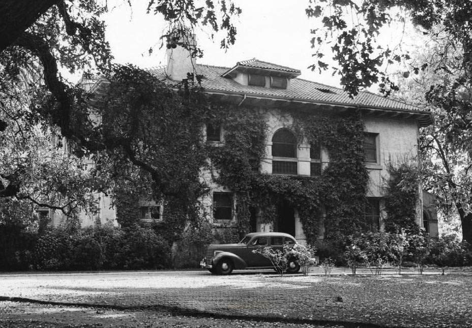 #89 Hayes Mansion front entrance with automobile parked in front, 1940s