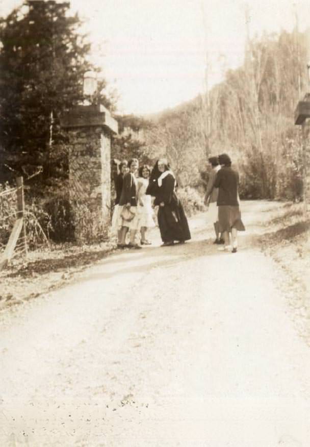 #105 Nun and Students from Notre Dame High School Outdoors, 1932