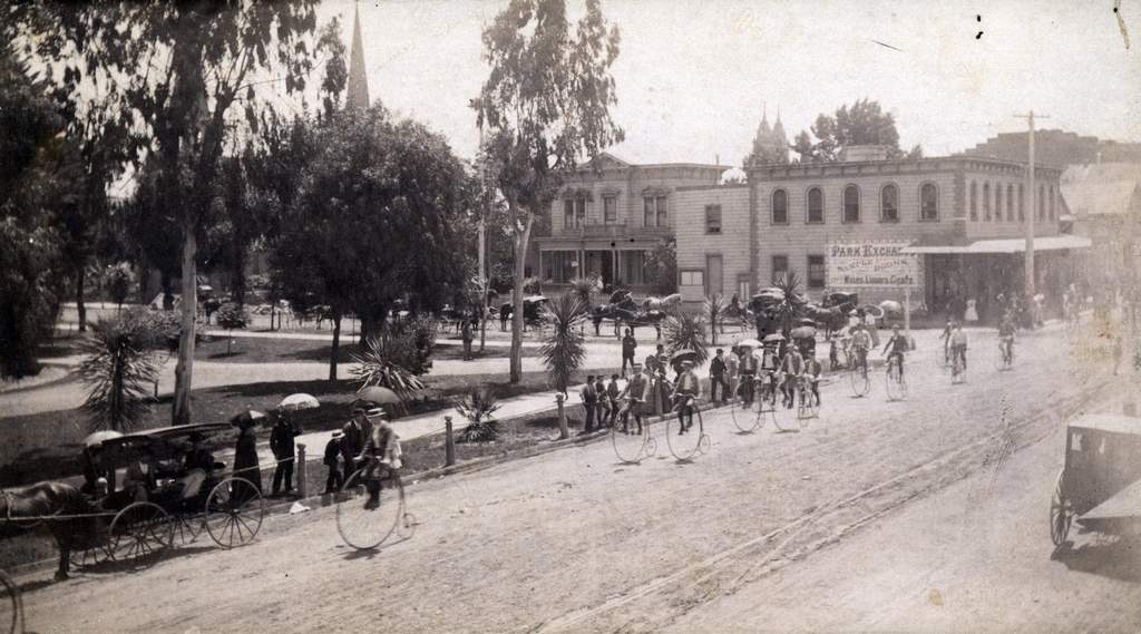 #254 Bicyclists riding past St. James Park, 1900