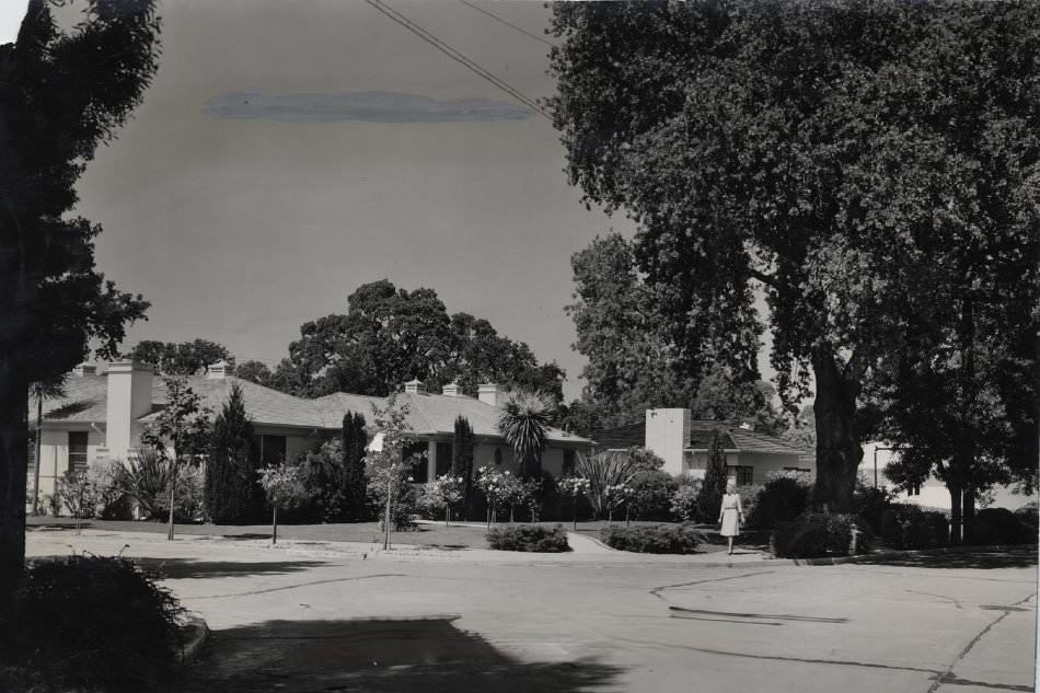 #46 Residence, woman walking on sidewalk, San Jose, 1947