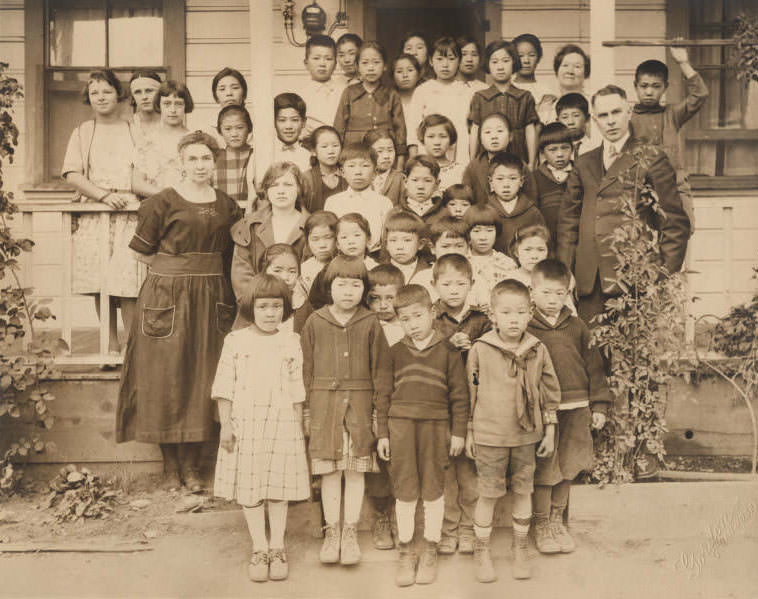 #56 Group of school children on steps, 1930