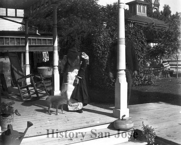 #74 woman feeding goat on porch, 1890s