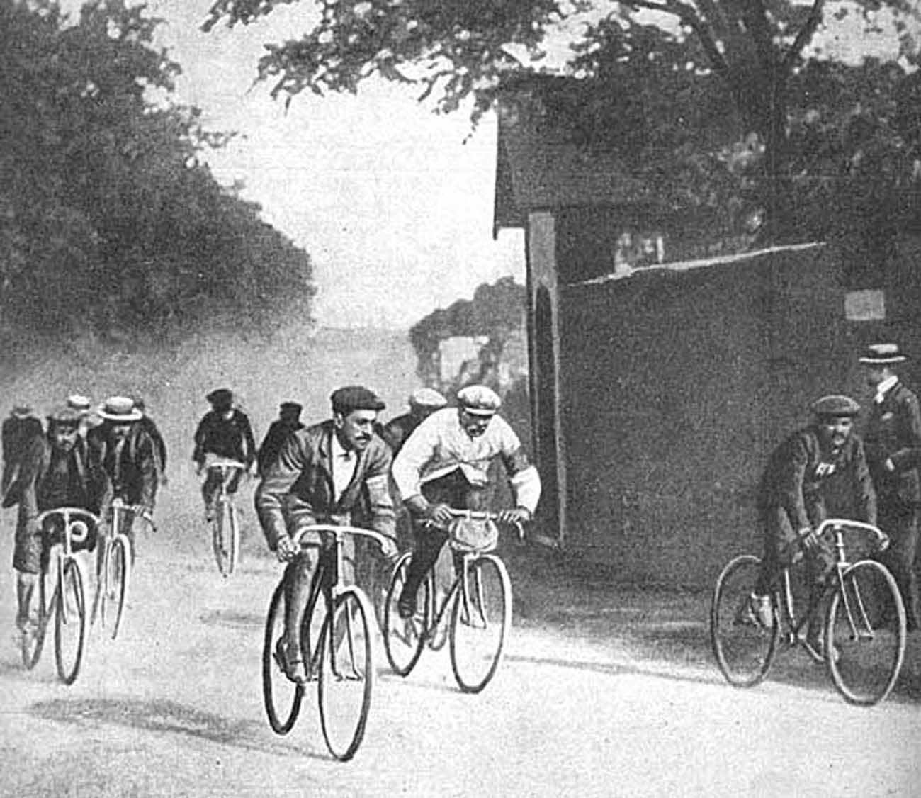 #10 Maurice Garin, in his trademark white coat and flat cap racing in the 1903 Tour.