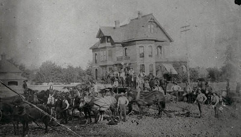 #18 Men with horses in front of the Wall residence located at 12th and Main Street, 1880s