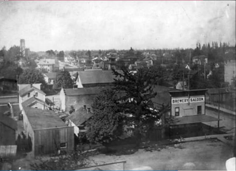 #37 Brewery Saloon located at 1907 Washington Street in early Vancouver with the St. James Church at left in the background, 1907
