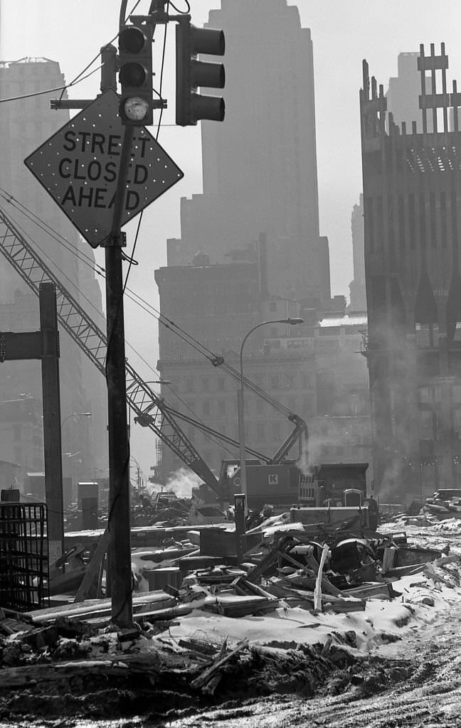 #26 Construction cranes sit on snow covered dirt as Towers One and Two of the World Trade Center are erected in the winter of 1970