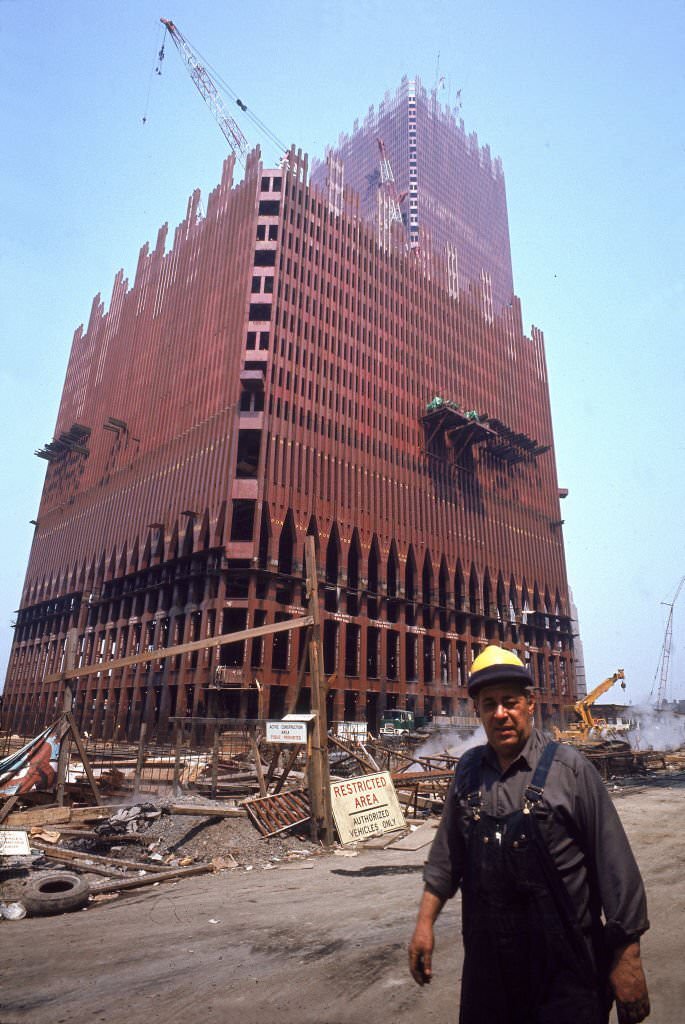 #35 A construction worker walks past the emerging structure of the Twin Towers on the World Trade Center site in downtown New York, 1970.