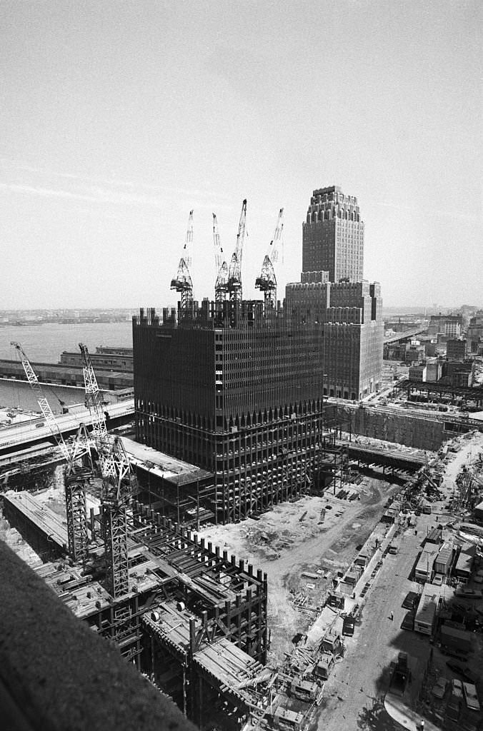 #49 One section of the gigantic 16-acre excavation site where the World Trade Center will be built comes to life.