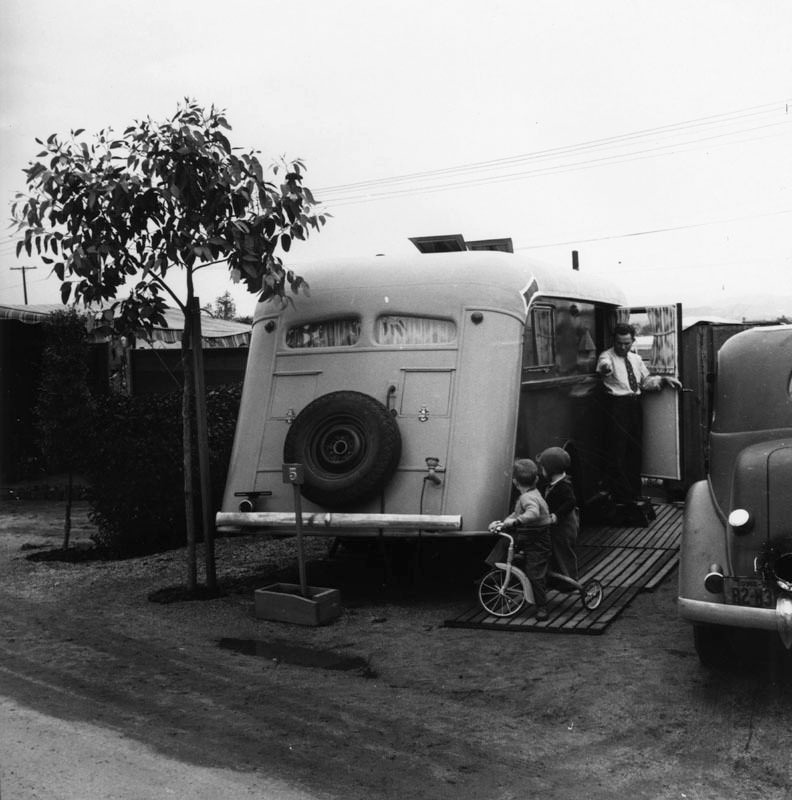 #80 A father talks to his two young sons at Olympic Trailer Court.