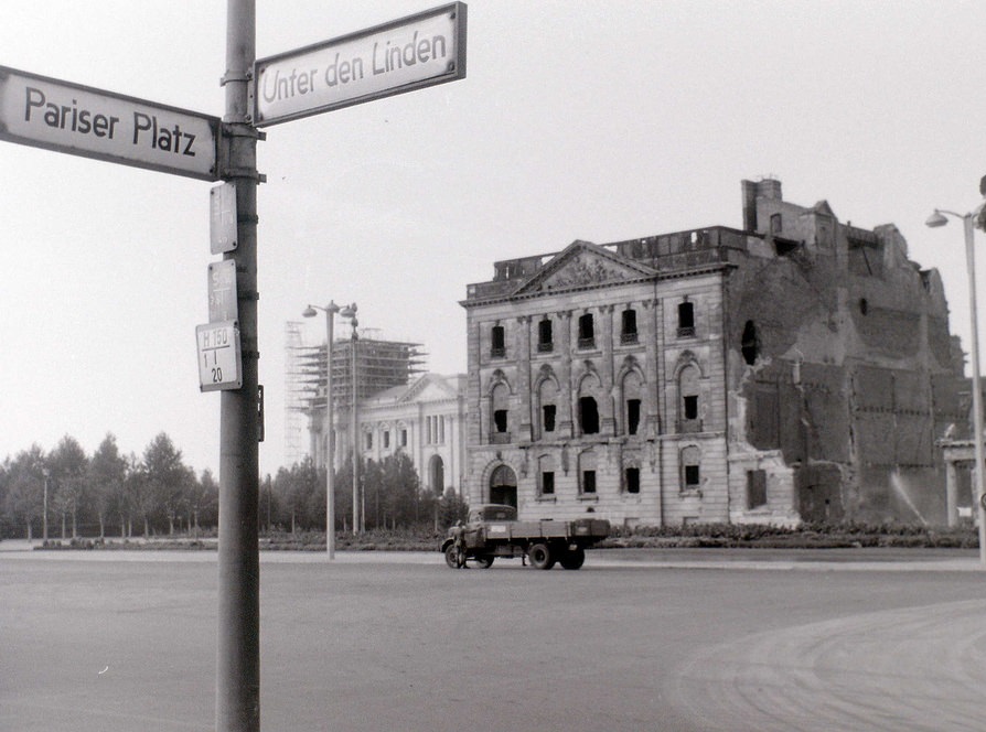 #69 The bombed building was on the north side of Unter den Linden in East Berlin, very near the Brandenburger Tor, with the Reichstag beyond it being in West Berlin.