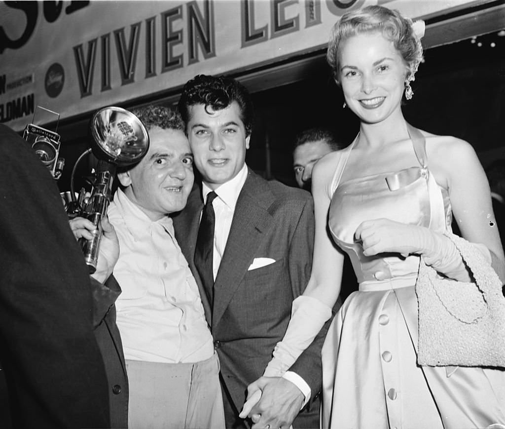 Photographer Arthur ‘Weegee’ Fellig with American film star couple Tony Curtis and Janet Leigh after a showing of ‘A Streetcar Named Desire’.