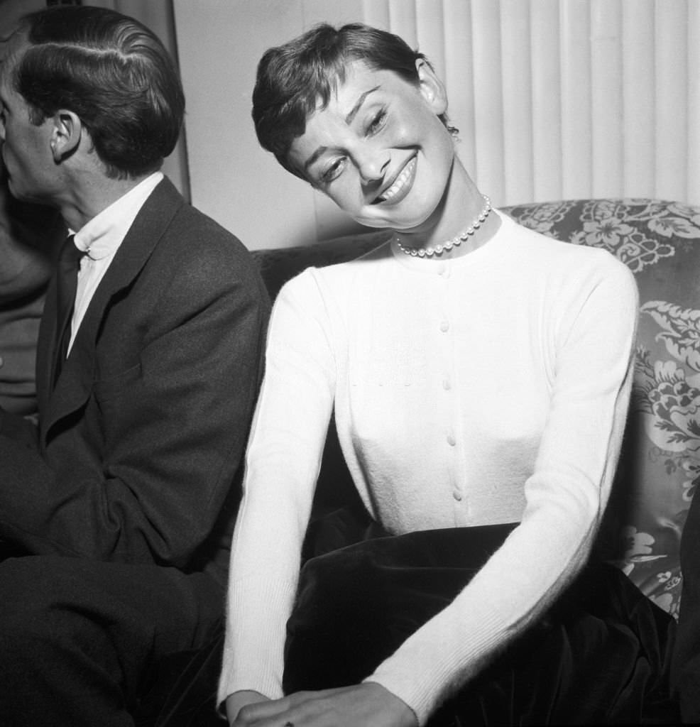 #22 Audrey Hepburn attending to a press conference for the movie War and Peace.