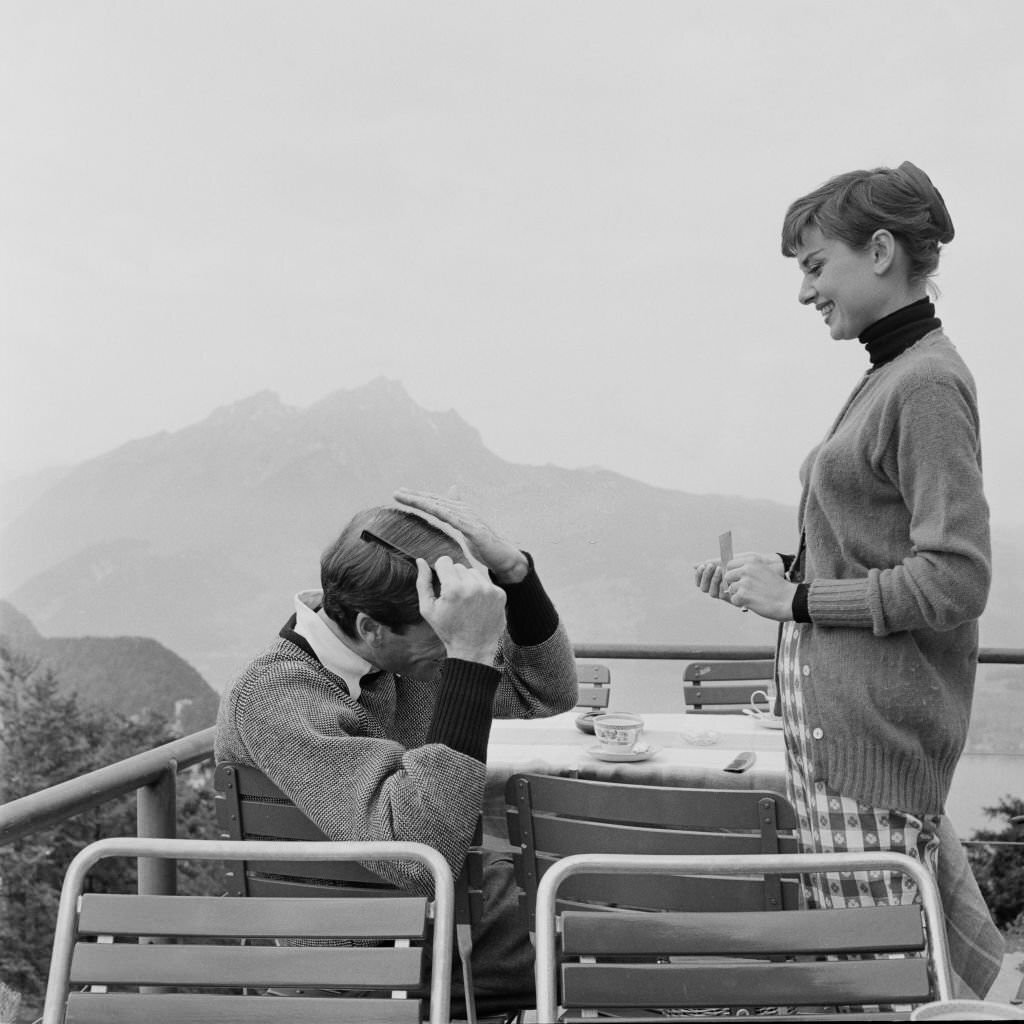 #31 Audrey Hepburn with Mel Ferrer on the terrace of the Restaurant Hammetschwand at the summit of the Bürgenstock, 1955