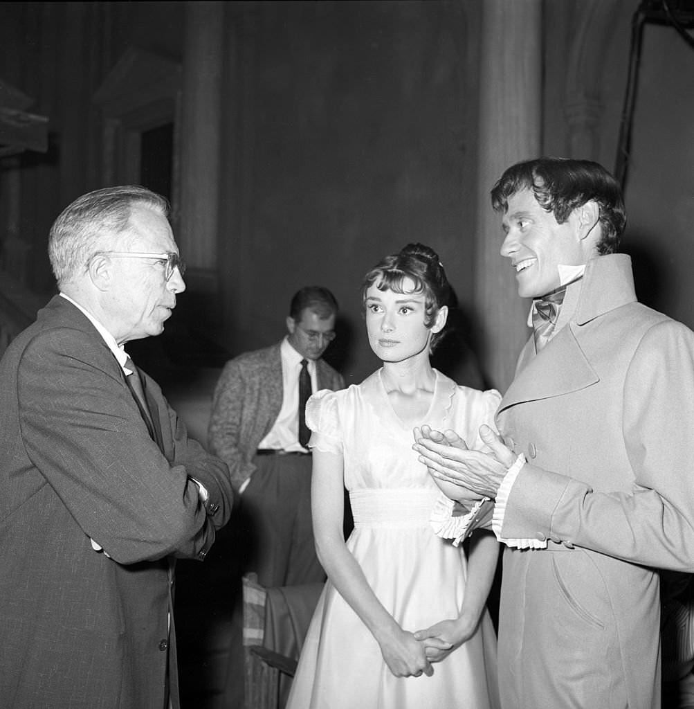 #33 King Vidor, Audrey Hepburn and Mel Ferrer on the movie set of War and Peace.