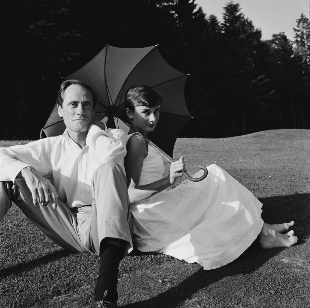 #43 Audrey Hepburn and Mel Ferrer on a golf course at the Bürgenstock resort, Switzerland, 1954.