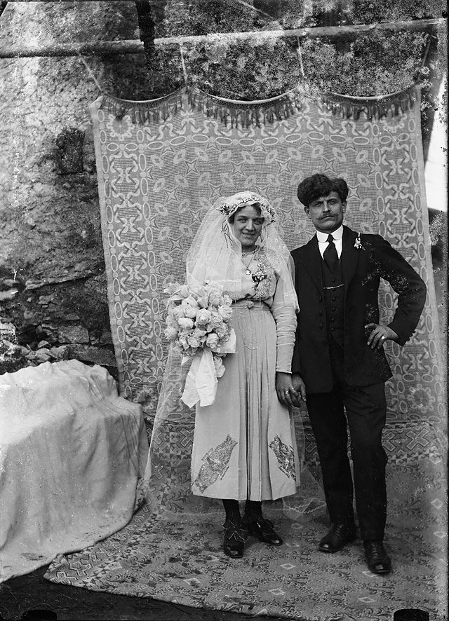 #16 A wedding couple staged in front of a cloth