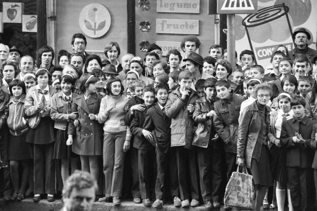 #71 Well-wishers stand outside the National Museum of Romanian History where Crown Prince Akihito and Crown Princess.